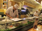 The itamae preparing sushi.
